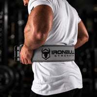 #color_grey | Lifter wearing Iron Bull Strength double prong lifting belt during a workout