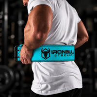 #color_olympic-blue | Lifter wearing Iron Bull Strength double prong lifting belt during a workout