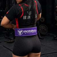#color_purple | Lifter wearing Iron Bull Strength double prong lifting belt during a workout